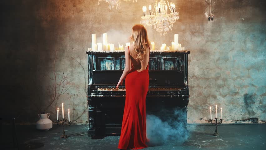 Fashion model blonde girl posing rear view hand touches old white black key plays the piano. Woman evening red sexy dress gothic lady pianist artist open bare back art music. dark room old style 4k