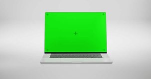 Green Screen Display Laptop And Zoom In On A White Background. Empty Green Mock-Up Monitor For Video Call, Website Template Presentation Or Game Applications. Blank Screen Monitor 3D Render
