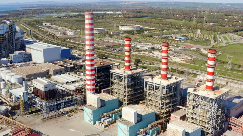 Aerial view on a large thermal power plant built along the coasts of the Mediterranean sea in Civitavecchia, near Rome, Italy.