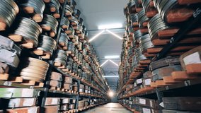 Passage between stacks with plenty of old film cases