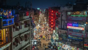 Timelapse view of traffic on Main Bazaar street in the vibrant Paharganj Market at night in Central Delhi, India. - Powered by Shutterstock - Get 15% off with code: PIKWIZARD15