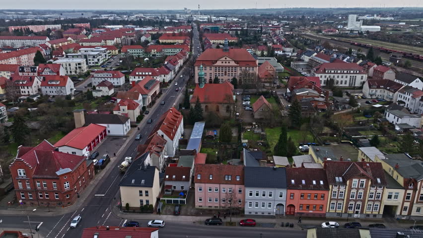 Drone shot revealing Saint Liborius church and "Marie Gerike" Secondary school ("Marie Gerike" Sekundarschule) , Haldensleben , Germany .