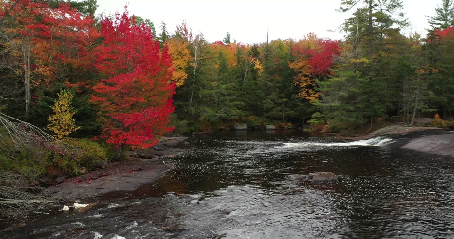 Aerial view of Bog River Falls near Tupper Lake in Adirondack Park in Upstate New York during fall.