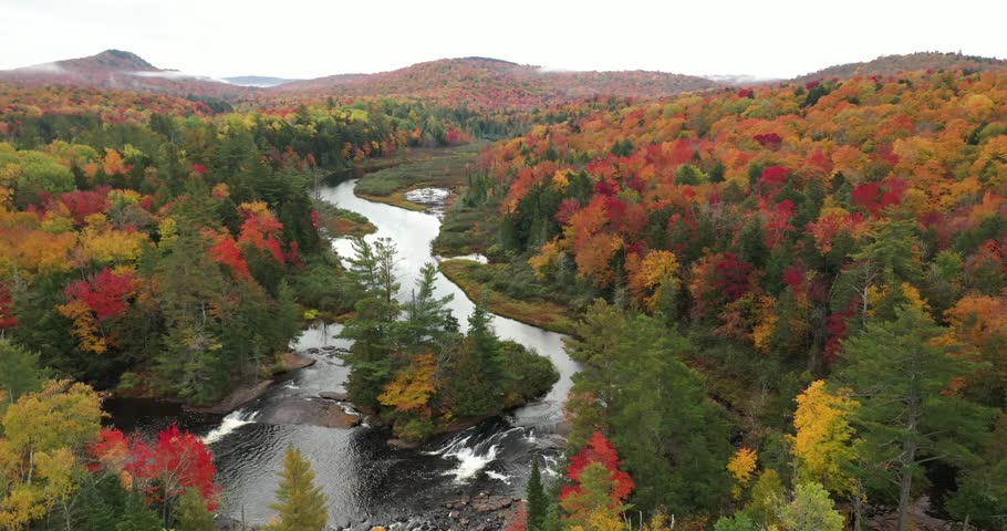 Aerial view of Bog River Falls near Tupper Lake in Adirondack Park in Upstate New York during fall.