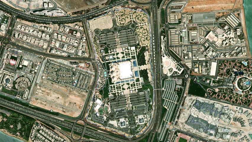 Earth zoom in from space to Abu Dhabi, UAE in Sheikh Zayed Grand Mosque. Followed by zoom out through clouds and atmosphere into space. Satellite view. Travel intro