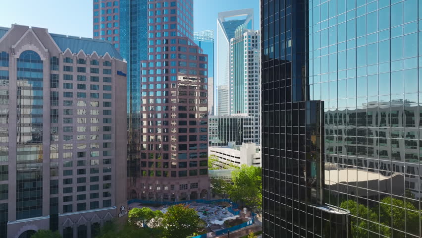 View from above of contemporary high skyscraper buildings in downtown district of Charlotte city in North Carolina, USA. American megapolis with business financial district