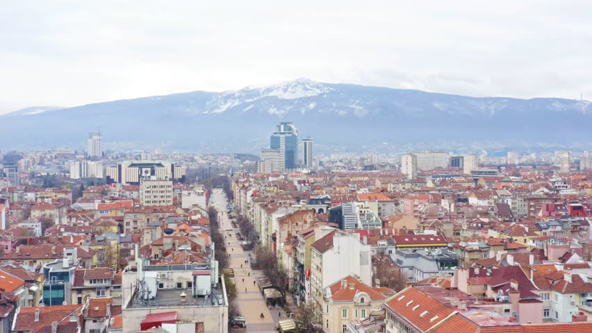 Sofia cityscape main streets and old city district with Vitosha mountain view. Travel to Bulgaria concept aerial view panorama
