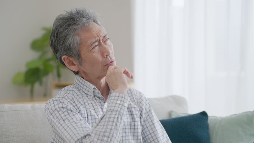 Asian man thinking in room Royalty-Free Stock Footage #1102051895