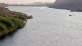 speedboat running fast at lake at day from top angle video is taken at kaylana lake jodhpur rajasthan india.