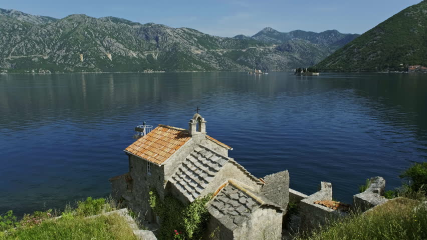 Old small Gospa od Andjela church on coast of Kotor bay, Montenegro, 4k