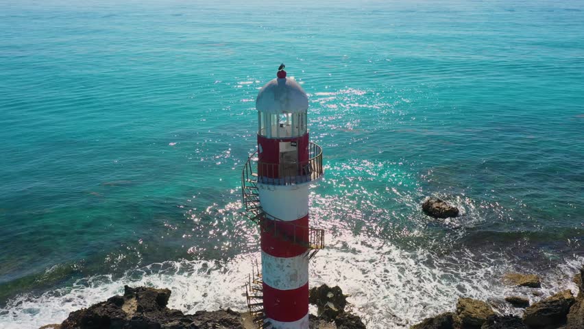 Aerial view of Punta Cancun Lighthouse. Hotel zone Сancun. Mexico. Two falcons sit on top.
