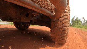 4x4 off road Pickup car wheels are running on a dirt road. Off-road truck car wheels moving on the dirty road with dust, wet and dry mud.  Point of view 4WD truck tire travel in the backcountry place
 - Powered by Shutterstock - Get 15% off with code: PIKWIZARD15