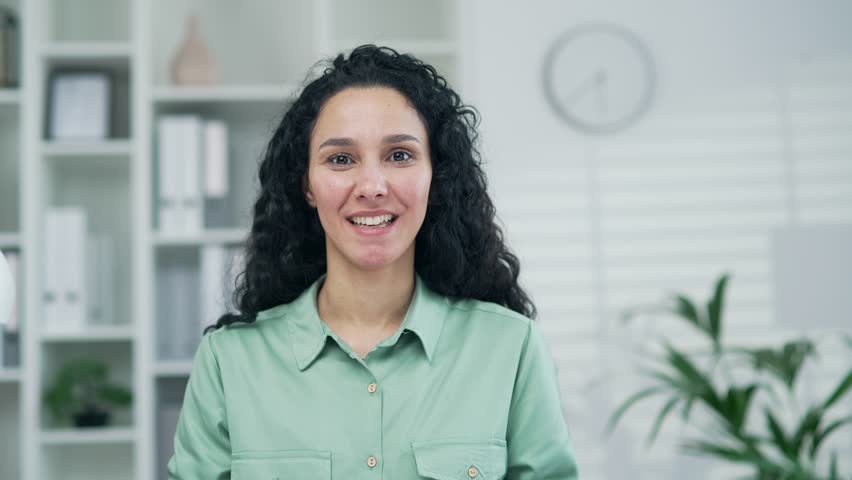 Webcam view of smiling young employee businesswoman looking at camera and talking by online meeting conference video call having conversation at modern office workplace indoors webinar teacher tutor Royalty-Free Stock Footage #1102061861