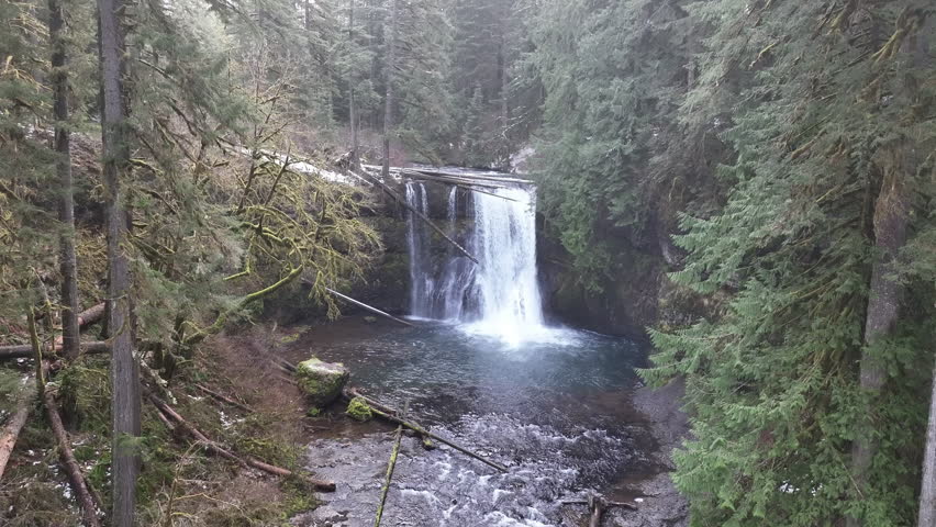 Silver Creek tumbles over the beautiful Upper North Falls near Silverton, Oregon. This heavily forested, scenic area, which has many impressive waterfalls, is about an hour drive south of Portland.