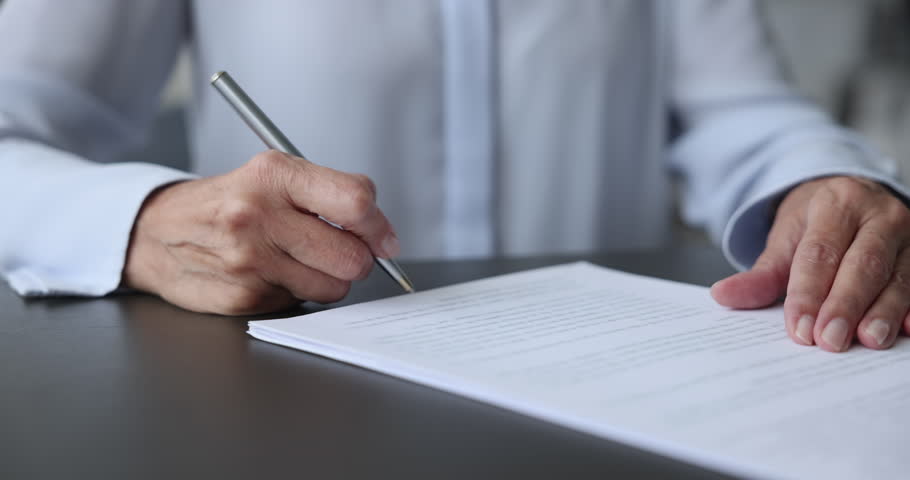 Close-up unknown middle aged business woman signing job contract, make successful purchase or investment deal, filling out legal document or form, signing an employment agreement after an interview Royalty-Free Stock Footage #1102066507