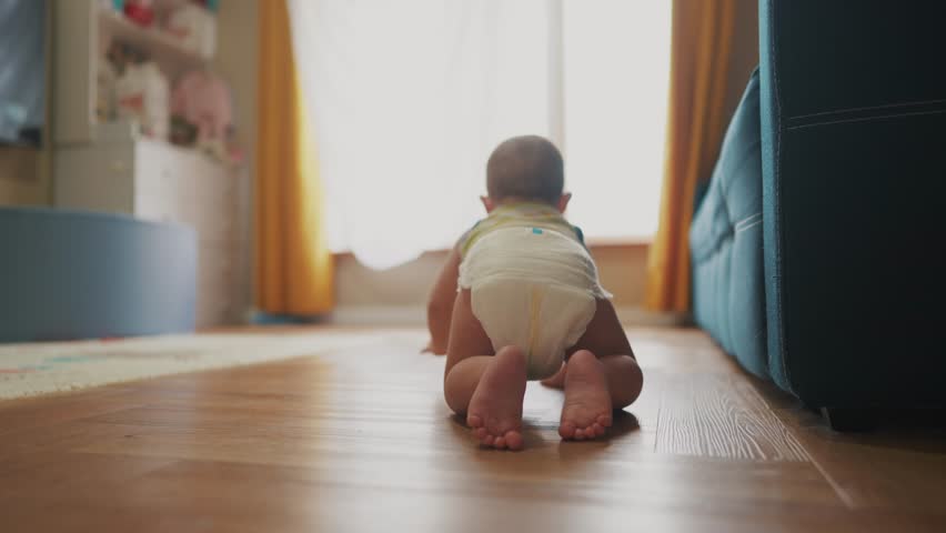baby newborn crawling on floor. happy family kindergarten kid concept. First steps, baby crawling view from the back. baby learns to crawl to explore lifestyle the world dream. first steps creeps Royalty-Free Stock Footage #1102067089