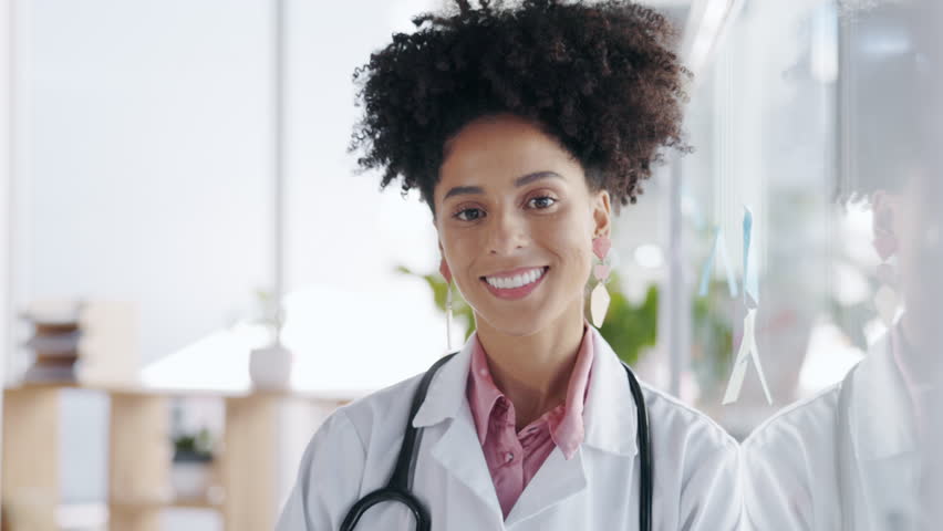 Face, woman and doctor with healthcare, smile and confidence in hospital, medicine and care. Portrait, medical professional and physician with skills, trust and help with happiness and consultant | Shutterstock HD Video #1102068867