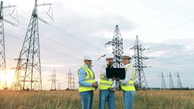 Three factory workers inspecting a power plant using a laptop - Powered by Shutterstock - Get 15% off with code: PIKWIZARD15