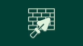 White Brick wall with trowel icon isolated on green background. 4K Video motion graphic animation.
