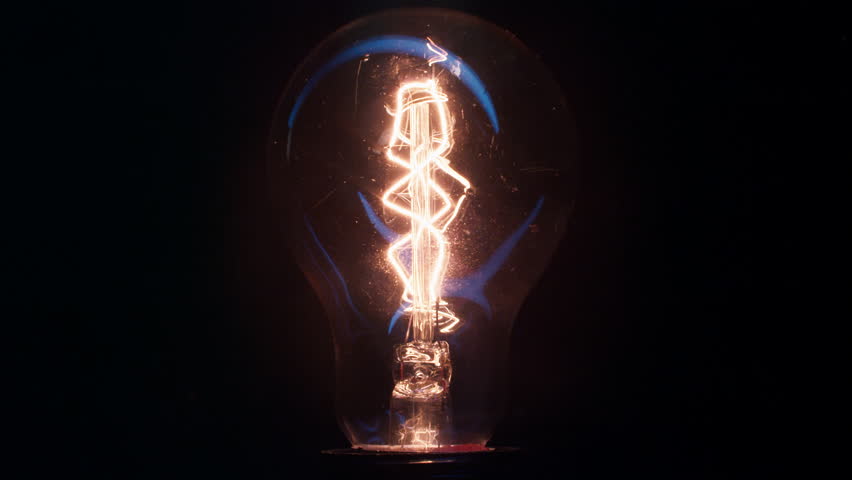 Close up shot of the filament inside a decorative incandescent bulb glowing and flickering Royalty-Free Stock Footage #1102071445