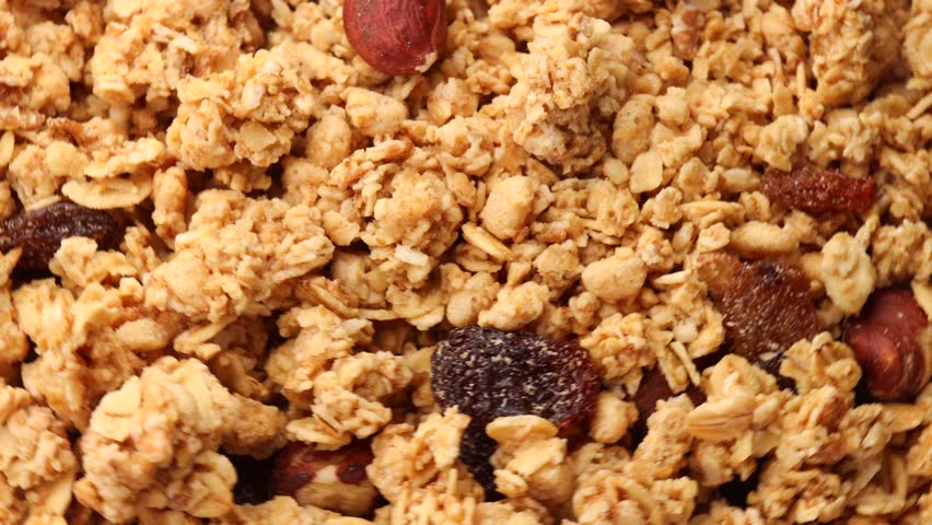 Granola, rotation in circle. Granola with Turning nuts. selective focus. Royalty-Free Stock Footage #1102075601