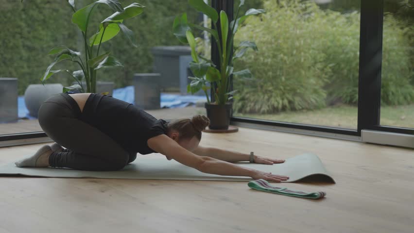 Caucasian woman is making warming up before her workout