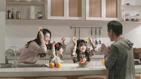 happy asian family having fun in kitchen at home - Powered by Shutterstock - Get 15% off with code: PIKWIZARD15