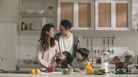 happy asian family enjoying time together in kitchen at home - Powered by Shutterstock - Get 15% off with code: PIKWIZARD15