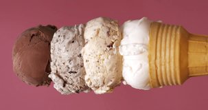 4K footage vertical video front view Time lapse, four flavors of ice cream melting on a cone.