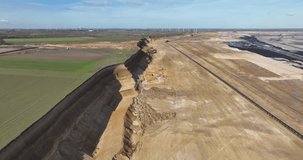 A fascinating aerial drone video showcasing the scale and impact of lignite mining, as massive open pits reveal the earth's hidden treasures.