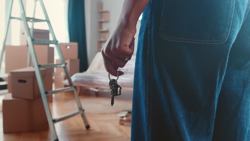 Landlord woman hand with keys to front door entering new house for first time with many boxes of things after renting property in steep area of city and contacting real estate agency Royalty-Free Stock Footage #1102084761