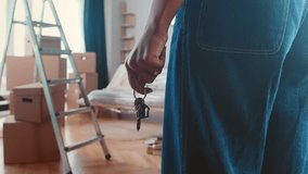 Landlord woman hand with keys to front door entering new house for first time with many boxes of things after renting property in steep area of city and contacting real estate agency - Powered by Shutterstock - Get 15% off with code: PIKWIZARD15