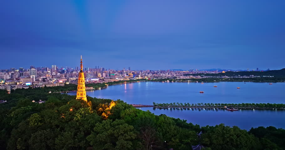 Aerial view of Hangzhou skyline and ancient Baochu Tower scenery at night, China.