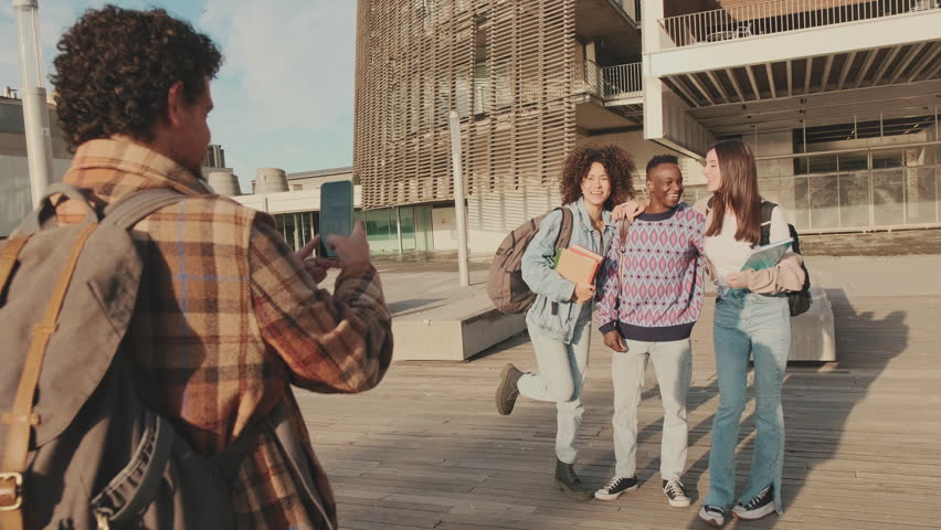 Young cheerful people make a joint photo