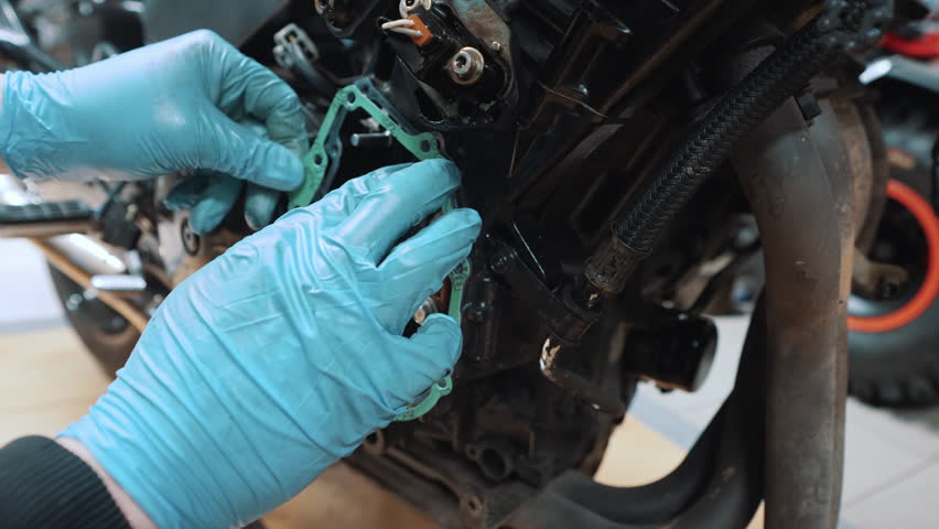 Close up, placing False neutral eliminator kit on the motorcycle transmission box. High quality 4k footage | Shutterstock HD Video #1102093739