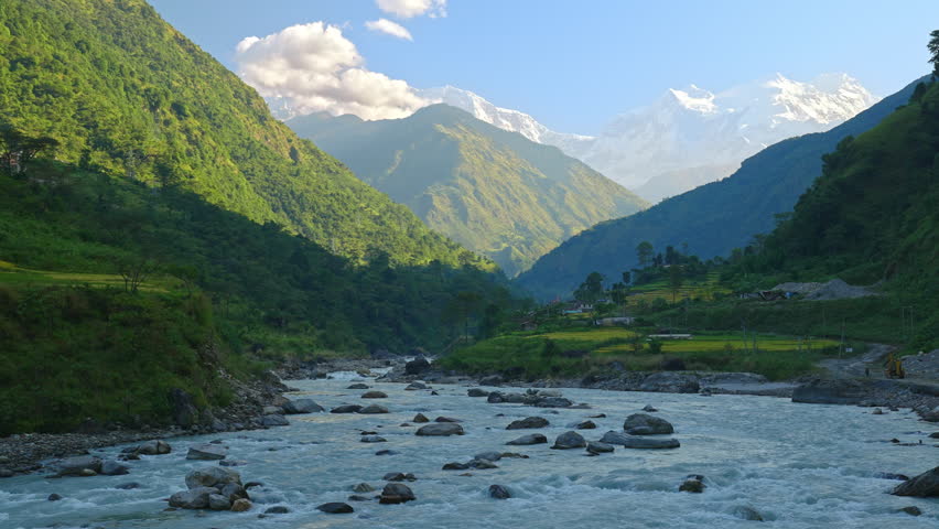 Amazing picturesque natural landscape of Himalayan mountains, river, and valley at sunrise, Annapurna, Nepal Royalty-Free Stock Footage #1102097765