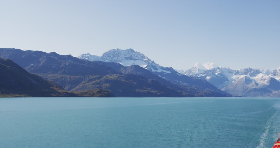 Alaska Glacier Bay National Park,USA. Glacial landscape showing mountain peaks and glaciers on clear blue sky perfect summer day. SLOW MOTION
