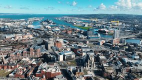 Aerial video of Belfast Cityscape Slyline on a sunny day in Northern Ireland 