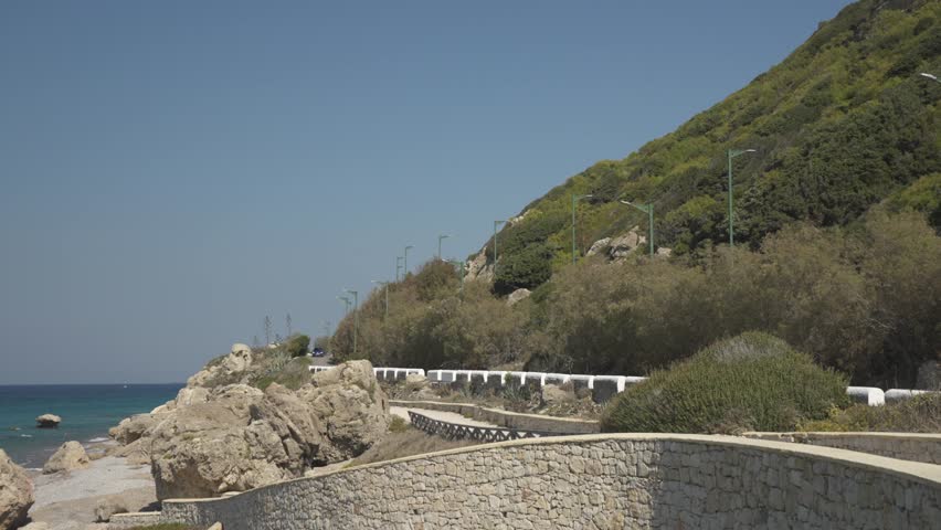 Coastal road and beach in Rhodes Town, Rhodes, Dodecanese Islands, Greek Islands, Greece, Europe