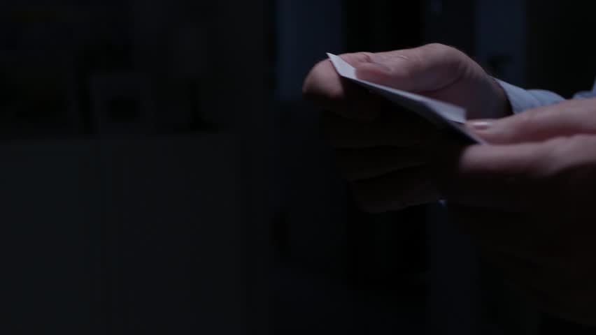 Blurred Shooting with a Person Opening an Envelope and Reading a Letter. Businessman Receiving a Document by Postage. Royalty-Free Stock Footage #1102120749