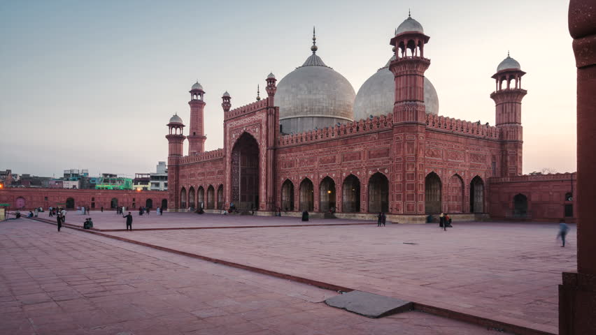 Timelapse view of historic landmark Badshahi Mosque, built in the 16th-century in the outskirts of the Walled City of Lahore, Punjab, Pakistan, zoom in.