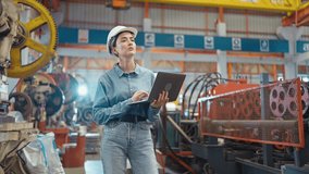 Engineer manager leader woman wearing helmet holding laptop walking and check in workplace area at manufacturing factory. Factory and Industrial plant concept - Powered by Shutterstock - Get 15% off with code: PIKWIZARD15