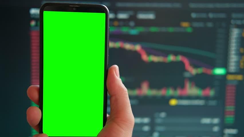 Black phone with blank mockup screen on rising stock graph. Closeup hand showing smartphone isolated green display, Online banking, Fund App use. Financial analyst on Invest Market. Bank collapse 2023 Royalty-Free Stock Footage #1102125215