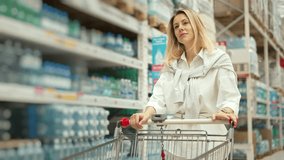 30s woman walk grocery store. Person carry food trolley. Girl buy meal supermarket. Customer lady shop goods. Female client go mall market. Buyer mom roll cart. Wife item bag. Eating row. Product sale - Powered by Shutterstock - Get 15% off with code: PIKWIZARD15