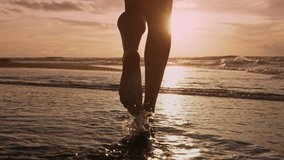 Beautiful Woman Walking on Marine Beach and Wet Legs Shape Moving Closeup. One Adult Girl at Bright Scenic Sea Going Swim or Splash. Modern Romance of Ocean Bathing and Amazing Summer Sky at Sundown - Powered by Shutterstock - Get 15% off with code: PIKWIZARD15