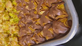 Pistachio baklava, Middle Eastern sweets in different styles Handheld vertical video