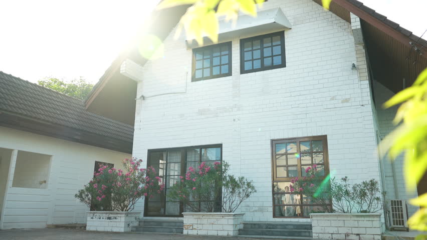 back view of a couple looking at their new home.