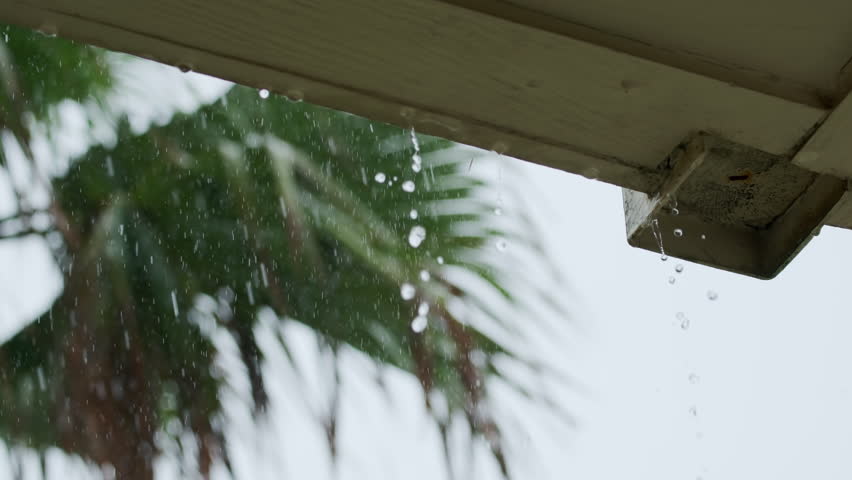 Heavy Rain storm Hitting House Roof and Rain Gutter. Slow motion Royalty-Free Stock Footage #1102143217