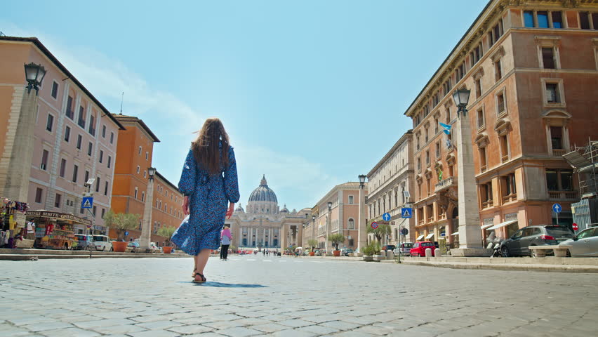 A young woman walking towards St. Peter