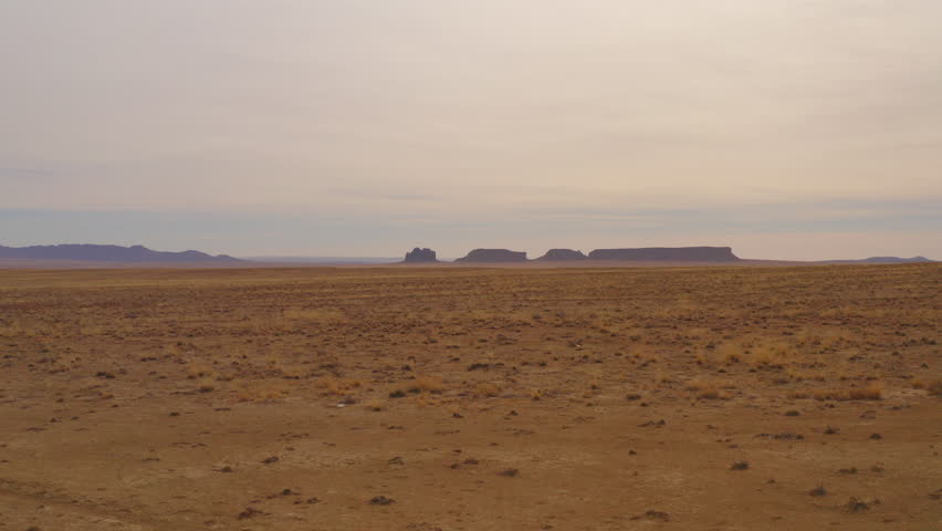 a low level aerial view of the high desert of New Mexico.